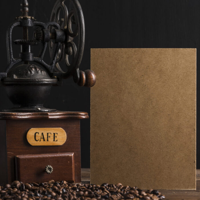 cardboard-vintage-coffee-grinder-near-beans